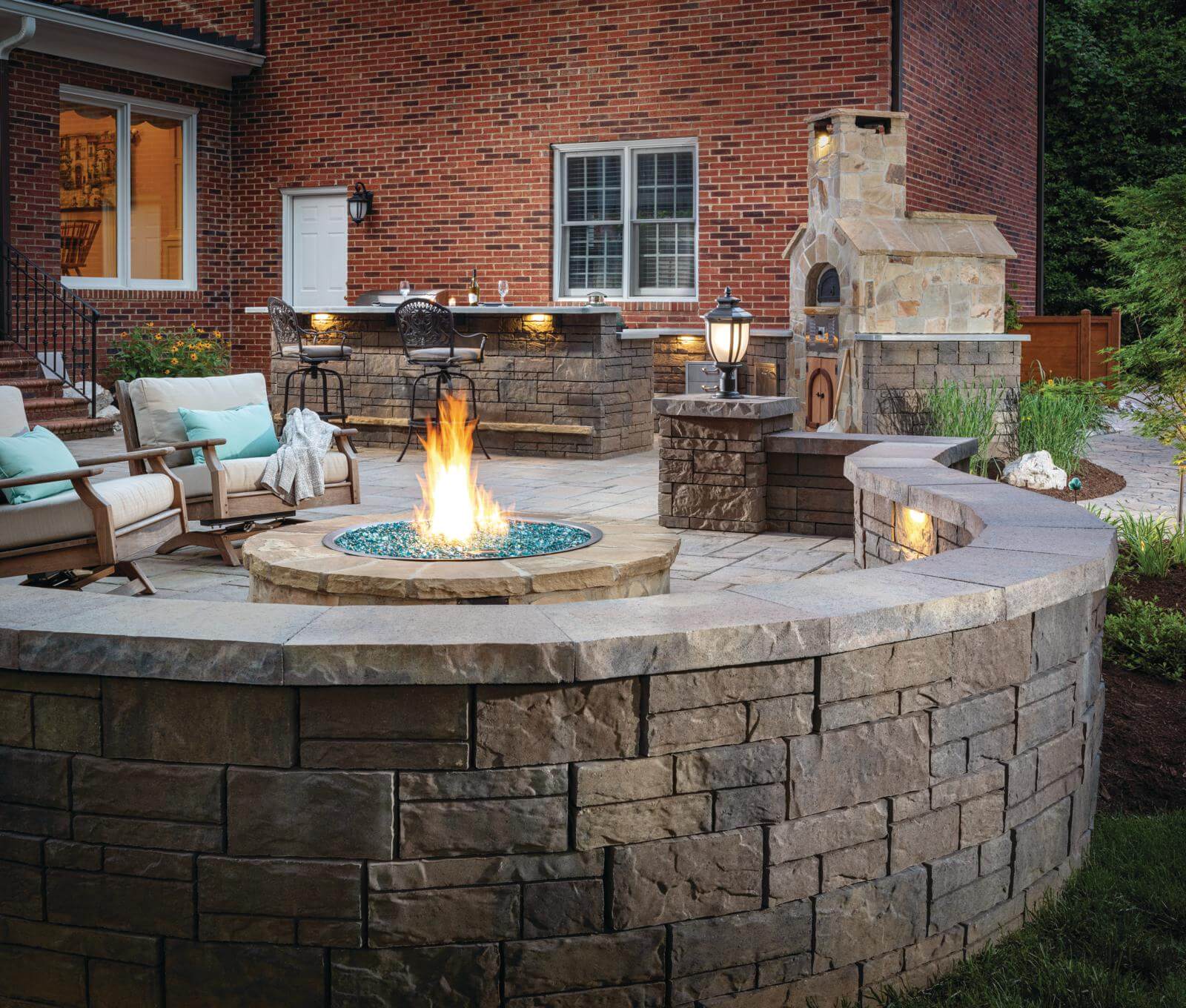 Background patio with firepit and outdoor kitchen and fire place